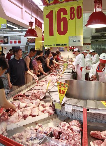 从养猪人到卖肉小贩:走访猪肉市场