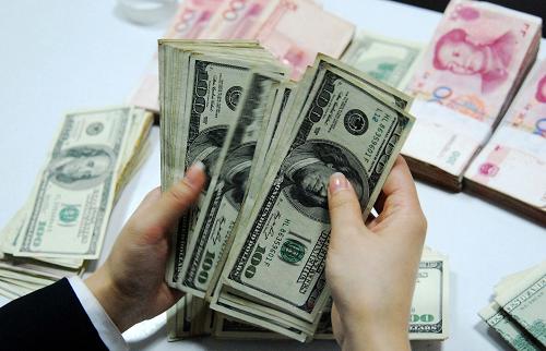 中国人民银行决定扩大外汇市场人民币兑美元汇