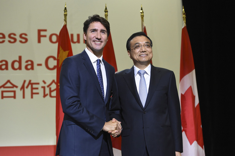 9月23日，国务院总理李克强在蒙特利尔会议中心与加拿大总理特鲁多共同出席第六届中加经贸合作论坛并发表致辞。