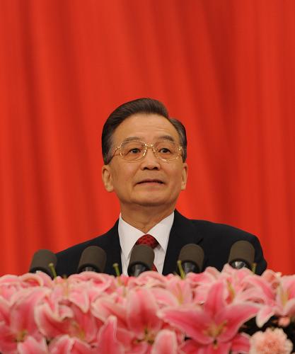 3月5日,第十一届全国人民代表大会第二次会议在北京人民大会堂开幕。国务院总理温家宝作政府工作报告。 新华社记者 樊如钧 摄