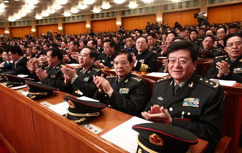 3月14日,第十一届全国人民代表大会第三次会议在北京人民大会堂举行闭幕会。这是全国人大代表在鼓掌。新华社记者 刘卫兵 摄