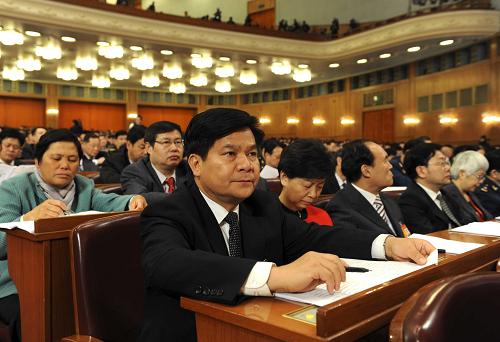 3月11日,十一届全国人大三次会议在北京人民大会堂举行第四次全体会议。这是代表在认真听会。新华社记者 陈树根 摄