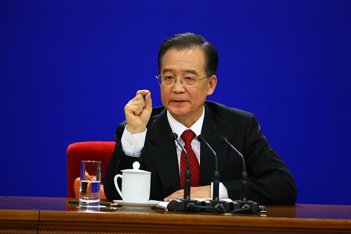 3月14日,国务院总理温家宝在北京人民大会堂与中外记者见面,并回答记者提问。 新华社记者陈建力 摄