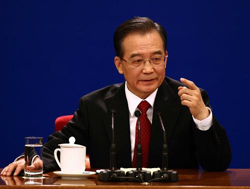 3月14日,国务院总理温家宝在北京人民大会堂与中外记者见面,并回答记者提问。新华社记者姚大伟 摄