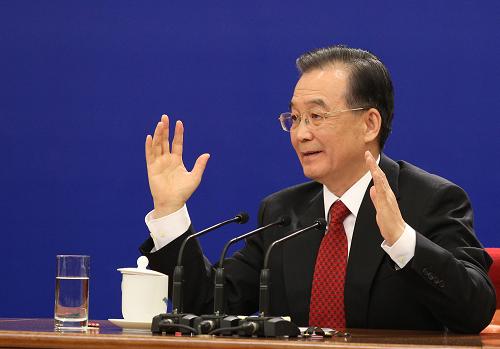 3月14日,国务院总理温家宝在北京人民大会堂与中外记者见面,并回答记者提问。 新华社记者丁林摄