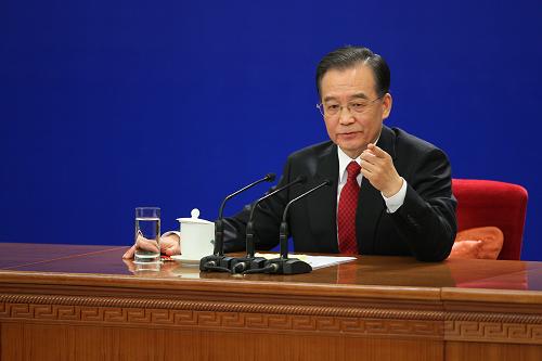 3月14日,国务院总理温家宝在北京人民大会堂与中外记者见面,并回答记者提问。 新华社记者邢广利 摄