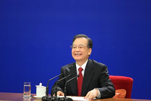 3月14日,国务院总理温家宝在北京人民大会堂与中外记者见面,并回答记者提问。 新华社记者 邢广利 摄