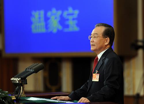 3月5日,第十一届全国人民代表大会第四次会议在北京人民大会堂开幕。国务院总理温家宝作政府工作报告。 新华社记者马占成摄