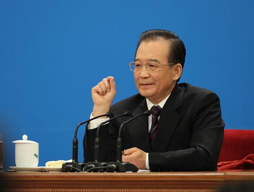 3月14日,国务院总理温家宝在北京人民大会堂与中外记者见面,并回答记者提问。 新华社记者 刘卫兵 摄