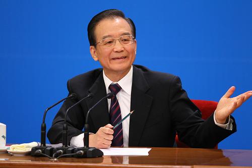 3月14日,国务院总理温家宝在北京人民大会堂与中外记者见面,并回答记者提问。 新华社记者 陈建力 摄