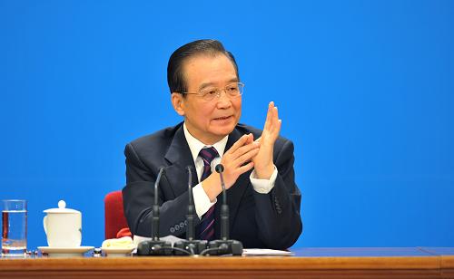 3月14日,国务院总理温家宝在北京人民大会堂与中外记者见面,并回答记者提问。 新华社记者 黄敬文 摄
