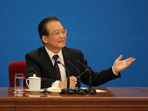 3月14日,国务院总理温家宝在北京人民大会堂与中外记者见面,并回答记者提问。 新华社记者 金立旺 摄