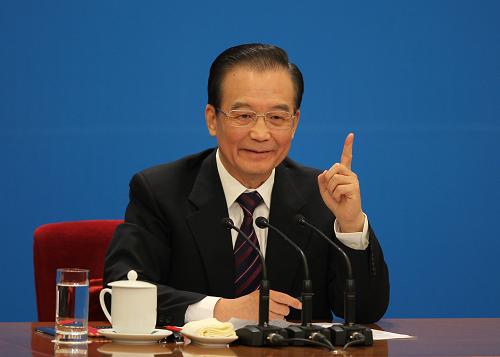 3月14日,国务院总理温家宝在北京人民大会堂与中外记者见面,并回答记者提问。 新华社记者 金立旺 摄