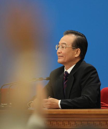 3月14日,国务院总理温家宝在北京人民大会堂与中外记者见面,并回答记者提问。 新华社记者 刘卫兵 摄