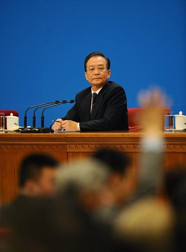 3月14日,国务院总理温家宝在北京人民大会堂与中外记者见面,并回答记者提问。 新华社记者 燕雁 摄