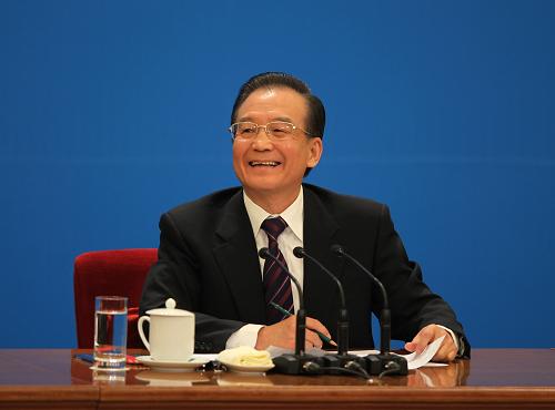 3月14日,国务院总理温家宝在北京人民大会堂与中外记者见面,并回答记者提问。 新华社记者 金立旺 摄