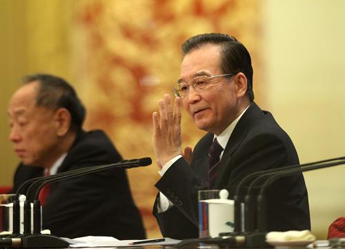 3月14日,国务院总理温家宝在北京人民大会堂与中外记者见面,并回答记者提问。 新华社记者 刘卫兵 摄
