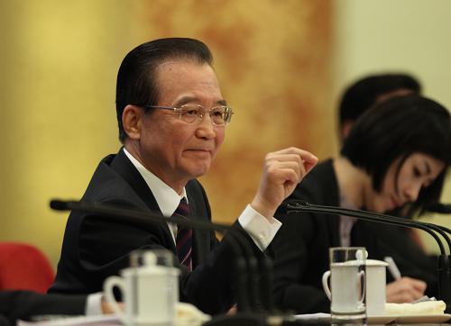 3月14日,国务院总理温家宝在北京人民大会堂与中外记者见面,并回答记者提问。 新华社记者 刘卫兵 摄