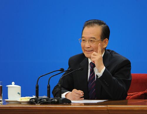 3月14日,国务院总理温家宝在北京人民大会堂与中外记者见面,并回答记者提问。 新华社记者 王建华 摄