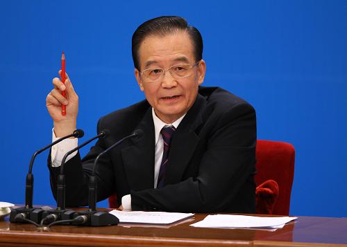 3月14日,国务院总理温家宝在北京人民大会堂与中外记者见面,并回答记者提问。 新华社记者 陈建力 摄