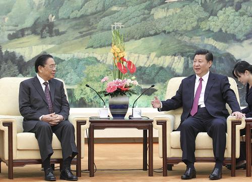 9月20日,中共中央政治局常委、国家副主席习近平在北京人民大会堂会见来华进行正式友好访问的老挝人民革命党中央总书记、国家主席朱马利。新华社记者 丁林 摄