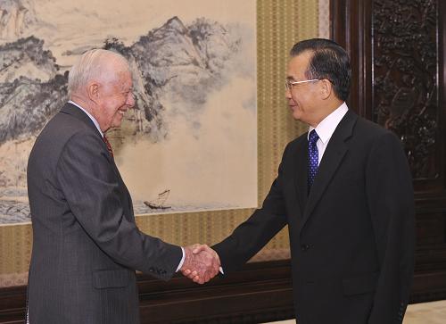 温家宝会见美国前总统卡特 9月6日,国务院总理温家宝在北京中南海紫光阁会见美国前总统卡特。 新华社记者黄敬文摄