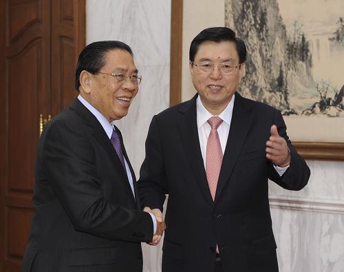 9月27日,中共中央政治局常委、全国人大常委会委员长张德江在北京钓鱼台国宾馆会见老挝人民革命党中央总书记、国家主席朱马里。新华社记者 谢环驰 摄
