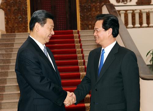 12月22日,正在越南访问的中共中央政治局常委、国家副主席习近平在河内会见越南总理阮晋勇。新华社记者 姚大伟 摄