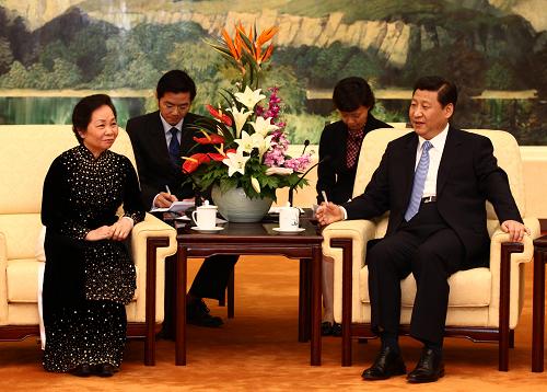 5月20日,中共中央政治局常委、国家副主席习近平在北京人民大会堂会见越南国家副主席阮氏缘。新华社记者 庞兴雷 摄