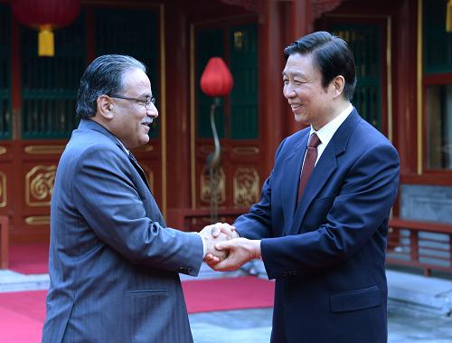 4月17日,中共中央政治局委员、国家副主席李源潮在北京会见由党主席普拉昌达率领的尼泊尔联合尼共(毛)代表团。 新华社记者马占成摄