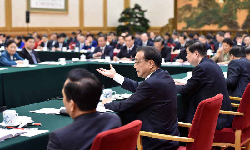 3月6日，中共中央政治局常委、国务院总理李克强参加十二届全国人大四次会议山东代表团的审议。新华社记者 高洁 摄