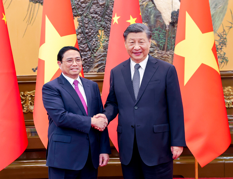 总统访华习会见越南总理范明政